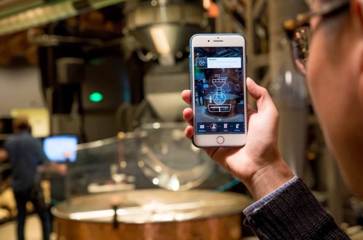 Аn augmented reality app is used in the new Starbucks Roastery in Shanghai, China.