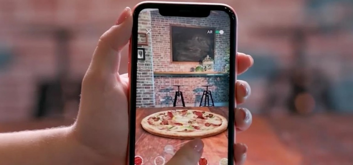 Domino's has released an application to let users create a pizza using AR